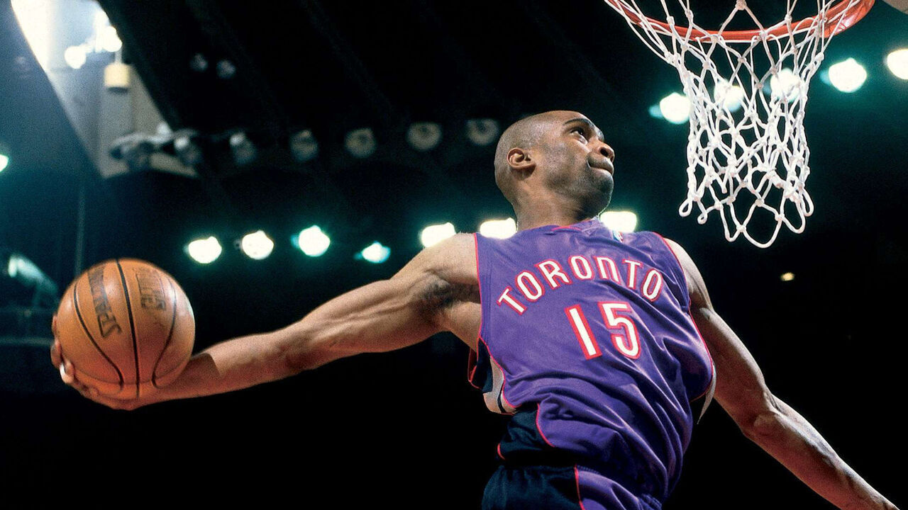 OAKLAND, CA - FEBRUARY 12: Vince Carter #15 of the Toronto Raptors goes for a dunk during the 2000 NBA All-Star Slam Dunk Contest at The Arena In Oakland on February 12, 2000 in Oakland, California. NOTE TO USER: User expressly acknowledges and agrees that by downloading and or using this photograph, user is consenting to the terms and conditions of the Getty Images License Agreement.