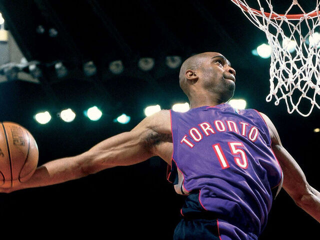 OAKLAND, CA - FEBRUARY 12: Vince Carter #15 of the Toronto Raptors goes for a dunk during the 2000 NBA All-Star Slam Dunk Contest at The Arena In Oakland on February 12, 2000 in Oakland, California. NOTE TO USER: User expressly acknowledges and agrees that by downloading and or using this photograph, user is consenting to the terms and conditions of the Getty Images License Agreement.