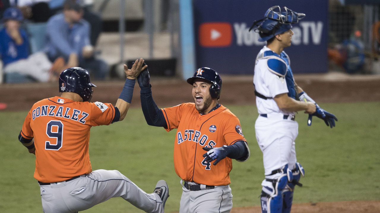 LOS ANGELES, CA - NOVEMBER 01: The Houston Astros' George Springer celebrates his two-run home run with teammate Marwin Gonzalez behind the Los Angeles Dodgers' Austin Barnes during Game 7 of the World Series at Dodger Stadium in Los Angeles, CA on Wednesday, November 1, 2017.