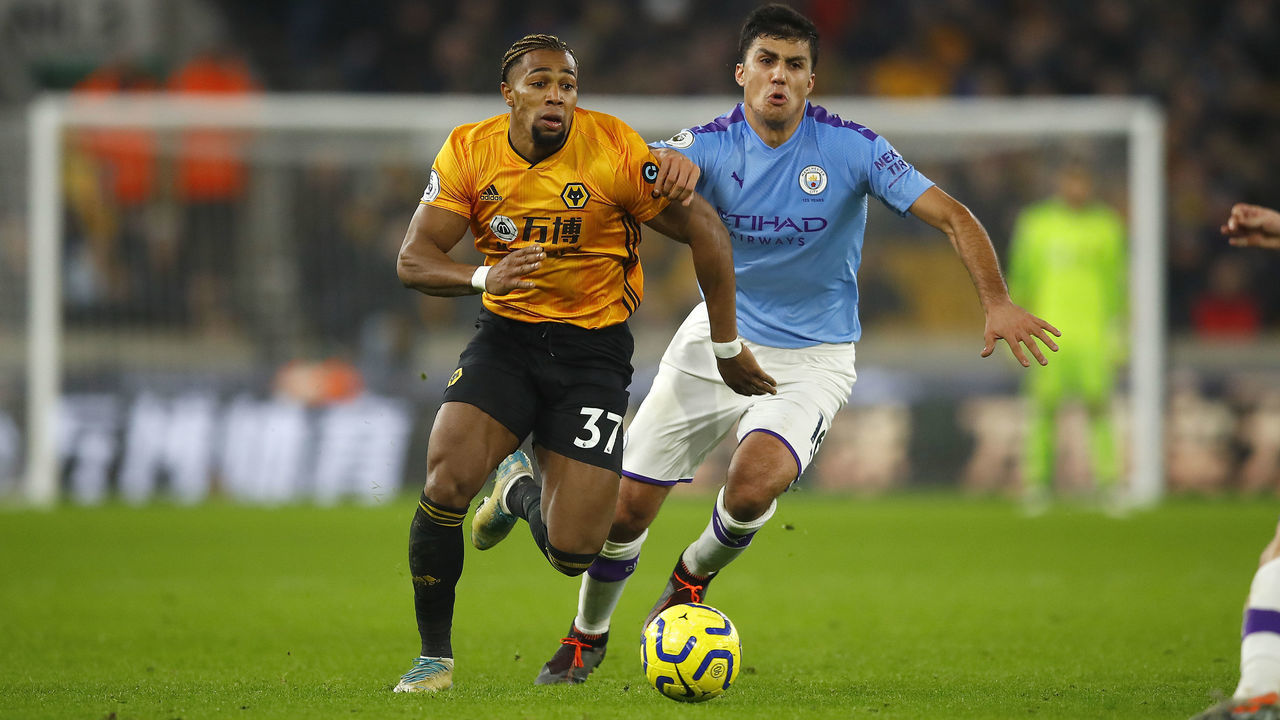 WOLVERHAMPTON, ENGLAND - DECEMBER 27: Adama Traore of Wolverhampton Wanderers competes with Rodrigo of Manchester City during the Premier League match between Wolverhampton Wanderers and Manchester City at Molineux on December 27, 2019 in Wolverhampton, United Kingdom.