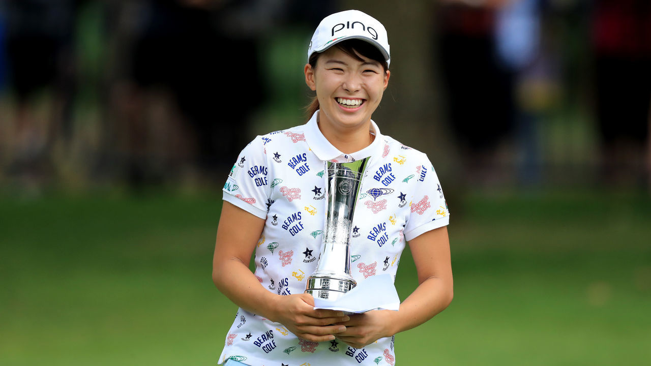 WOBURN, ENGLAND - AUGUST 04: Hinako Shibuno of Japan holds the trophy after her one shot victory in the final round of the AIG Women's British Open on the Marquess Course at Woburn Golf Club on August 04, 2019 in Woburn, England.
