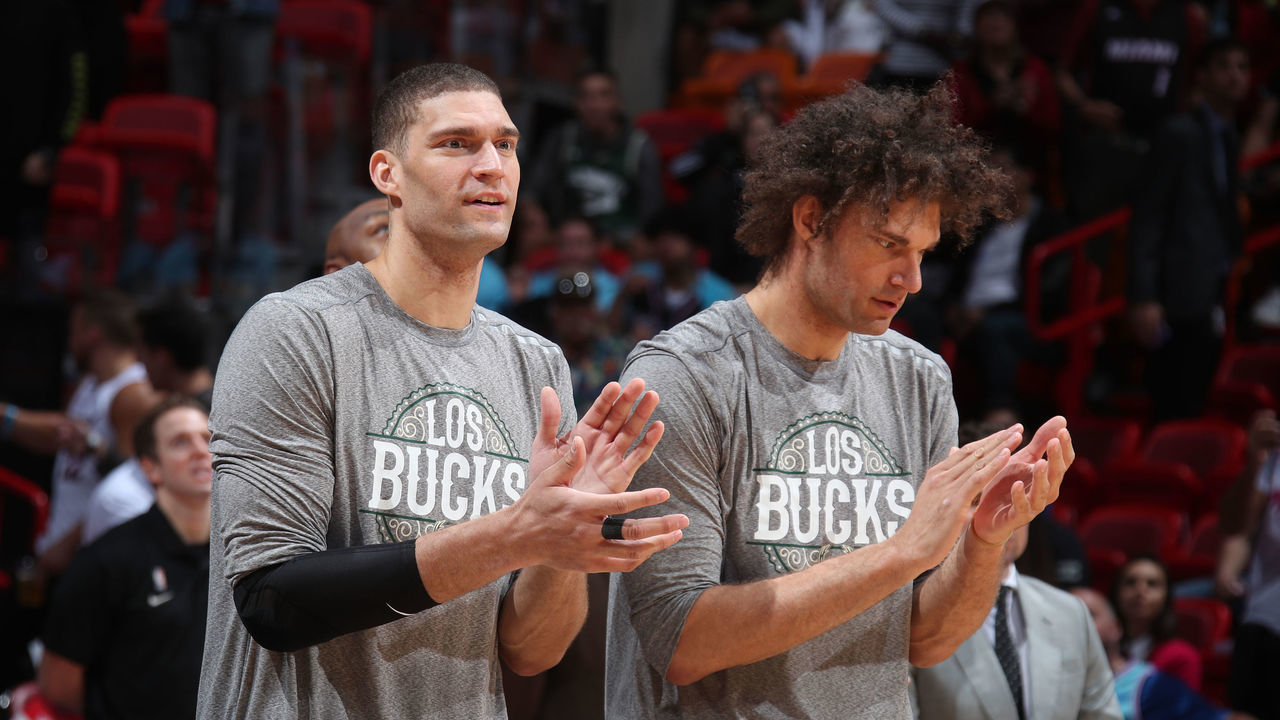 MIAMI, FL - MARCH 2: Brook Lopez #11 of the Milwaukee Bucks and Robin Lopez #42 of the Milwaukee Bucks celebrate on the bench during the game against the Miami Heat on March 02, 2020 at American Airlines Arena in Miami, Florida. Mandatory Copyright Notice: Copyright 2020 NBAE