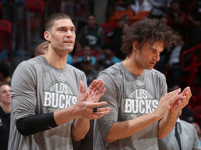 MIAMI, FL - MARCH 2: Brook Lopez #11 of the Milwaukee Bucks and Robin Lopez #42 of the Milwaukee Bucks celebrate on the bench during the game against the Miami Heat on March 02, 2020 at American Airlines Arena in Miami, Florida. Mandatory Copyright Notice: Copyright 2020 NBAE