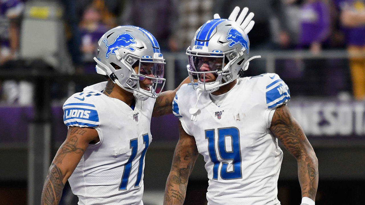 MINNEAPOLIS, MINNESOTA - DECEMBER 08: Marvin Jones #11 of the Detroit Lions congratulates teammate Kenny Golladay #19 on a touchdown against the Minnesota Vikings during the fourth quarter of the game at U.S. Bank Stadium on December 8, 2019 in Minneapolis, Minnesota. The Vikings defeated the Lions 20-7.