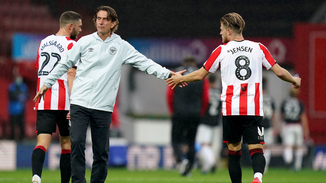 Brentford manager Thomas Frank (left) with Mathias Jensen (right) after the final whistle during the Sky Bet Championship match at Griffin Park, London.