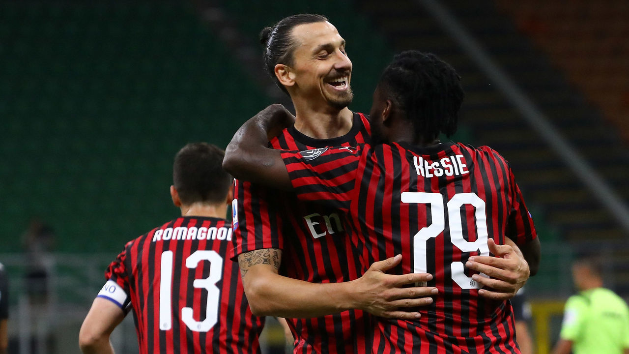MILAN, ITALY - JULY 07: Franck Kessie of AC Milan celebrates his goal with his team-mate Zlatan Ibrahimovic (L) during the Serie A match between AC Milan and Juventus at Stadio Giuseppe Meazza on July 7, 2020 in Milan, Italy.