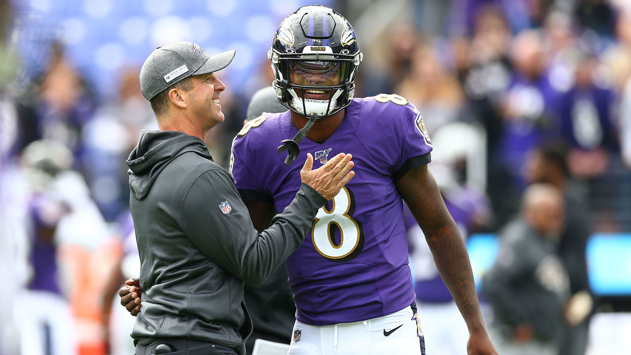 BALTIMORE, MD - OCTOBER 13: Head coach John Harbaugh interacts with Lamar Jackson #8 of the Baltimore Ravens prior to playing against the Cincinnati Bengals at M&T Bank Stadium on October 13, 2019 in Baltimore, Maryland.