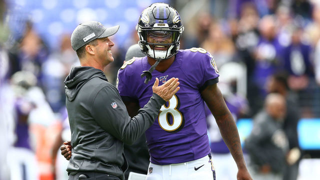 BALTIMORE, MD - OCTOBER 13: Head coach John Harbaugh interacts with Lamar Jackson #8 of the Baltimore Ravens prior to playing against the Cincinnati Bengals at M&T Bank Stadium on October 13, 2019 in Baltimore, Maryland.