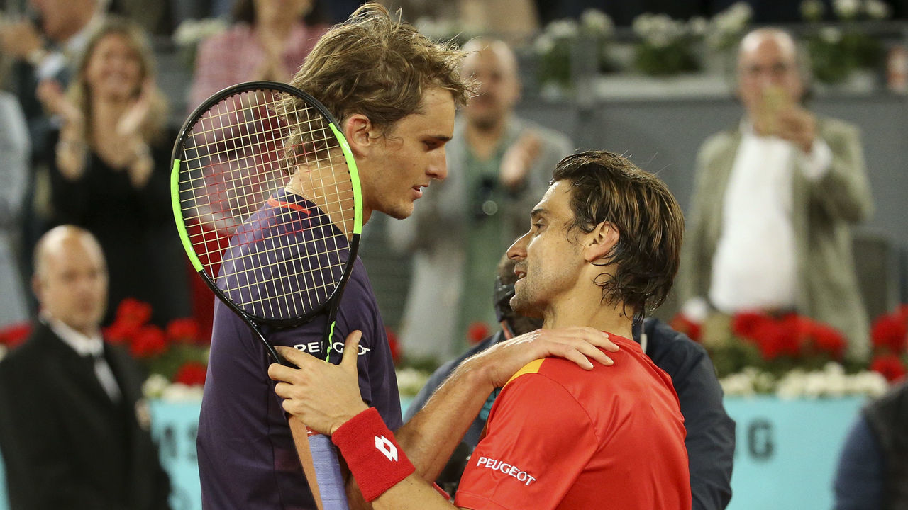 MADRID, SPAIN - MAY 8: Alexander Zverev of Germany hugs David Ferrer of Spain after defeating him for his last match on tour during day 5 of the Mutua Madrid Open at La Caja Magica on May 8, 2019 in Madrid, Spain.