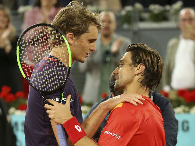 MADRID, SPAIN - MAY 8: Alexander Zverev of Germany hugs David Ferrer of Spain after defeating him for his last match on tour during day 5 of the Mutua Madrid Open at La Caja Magica on May 8, 2019 in Madrid, Spain.
