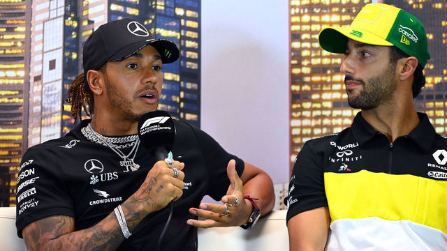 MELBOURNE, AUSTRALIA - MARCH 12: Lewis Hamilton of Great Britain and Mercedes GP speaks to the media as Daniel Ricciardo of Australia and Renault Sport F1 looks on during previews ahead of the F1 Grand Prix of Australia at Melbourne Grand Prix Circuit on March 12, 2020 in Melbourne, Australia.