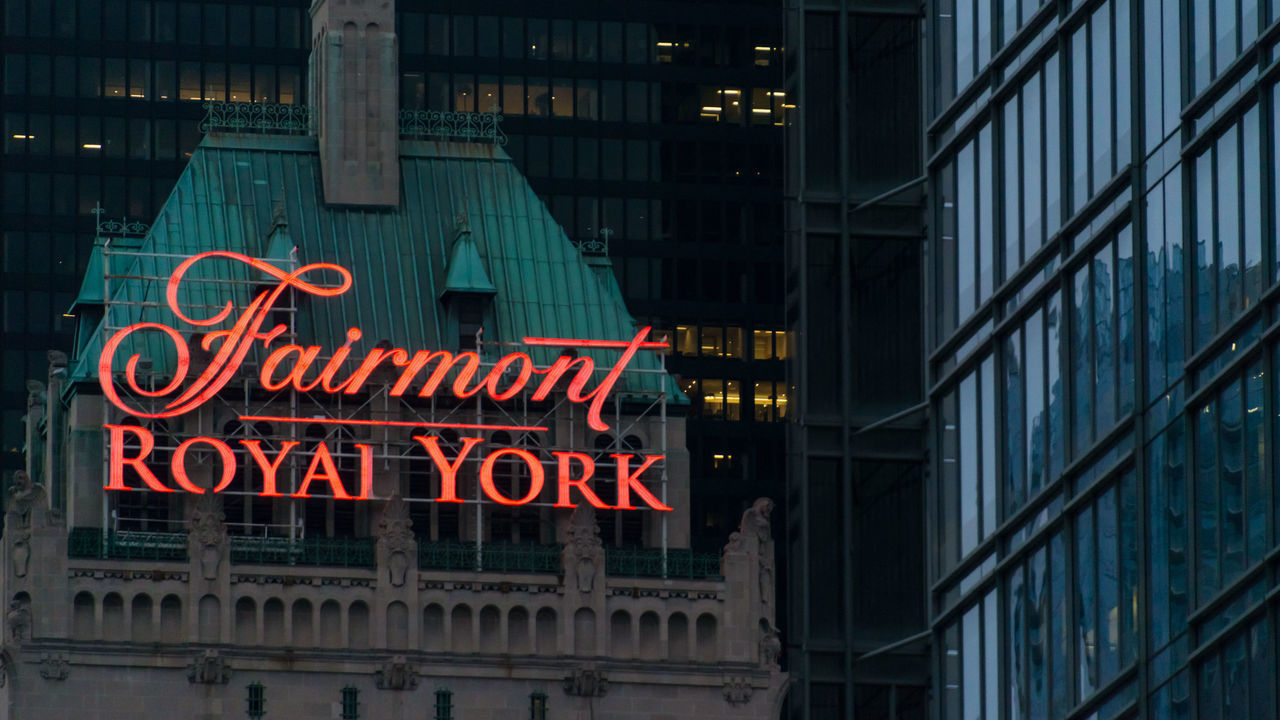 TORONTO, ONTARIO, CANADA - 2015/06/20: Fairmont Royal York sign on the roof at night. The Fairmont Royal York Hotel, formerly the Royal York Hotel and still often so called, is a large and historic hotel in downtown Toronto, Ontario, Canada, at 100 Front Street West.