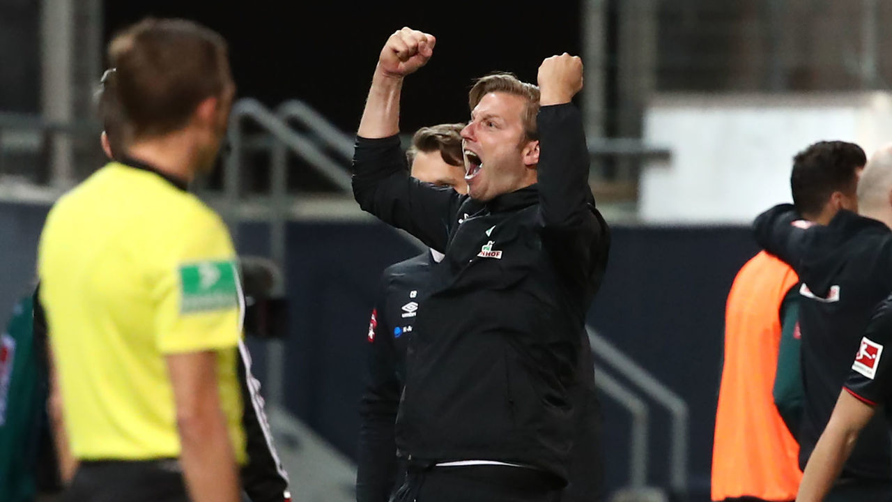 06 July 2020, Baden-Wuerttemberg, Heidenheim: Football: Bundesliga, relegation, return match, 1st FC Heidenheim - Werder Bremen in the Voith-Arena. Bremen's coach Florian Kohfeldt (M) cheers for the 1:2 goal. IMPORTANT NOTE: According to the regulations of the DFL Deutsche Fußball Liga or the DFB Deutscher Fußball-Bund it is prohibited to use or have used in the stadium and/or photographs taken of the match in the form of sequence pictures and/or video-like photo series. Photo: Tom Weller/dpa