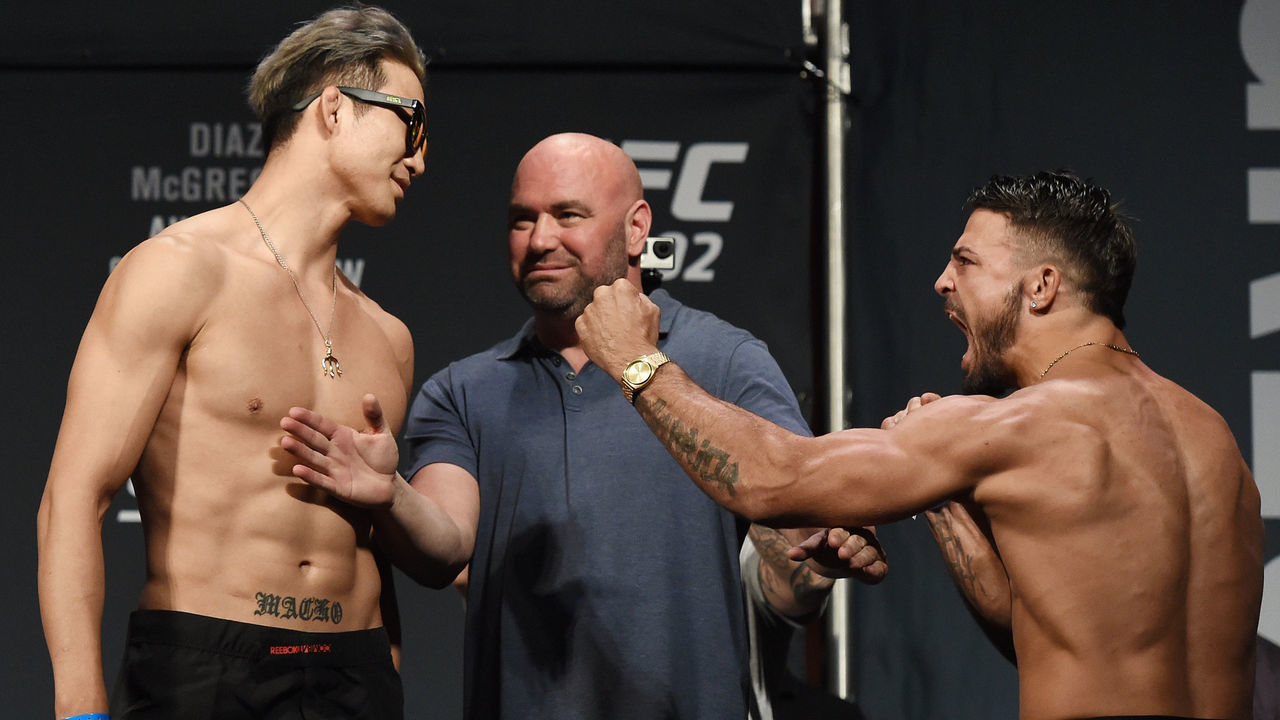 LAS VEGAS, NV - AUGUST 19: UFC President Dana White (C) looks on as mixed martial artists Hyun Gyu Lim (L) and Mike Perry (R) face off during their weigh-in for UFC 202 at MGM Grand Conference Center on August 19, 2016 in Las Vegas, Nevada. The fighters will meet in a welterweight bout on August 20, 2016, at T-Mobile Arena in Las Vegas.