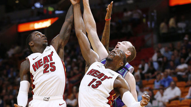 MIAMI, FLORIDA - MARCH 11: Bam Adebayo #13 and Kendrick Nunn #25 of the Miami Heat battle for a rebound with Cody Zeller #40 of the Charlotte Hornets during the first half at American Airlines Arena on March 11, 2020 in Miami, Florida. NOTE TO USER: User expressly acknowledges and agrees that, by downloading and/or using this photograph, user is consenting to the terms and conditions of the Getty Images License Agreement.