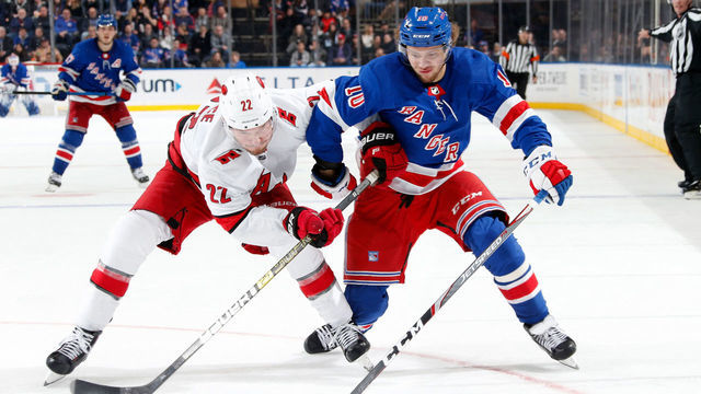 NEW YORK, NY - DECEMBER 27: Artemi Panarin #10 of the New York Rangers skates against Brett Pesce #22 of the Carolina Hurricanes at Madison Square Garden on December 27, 2019 in New York City.