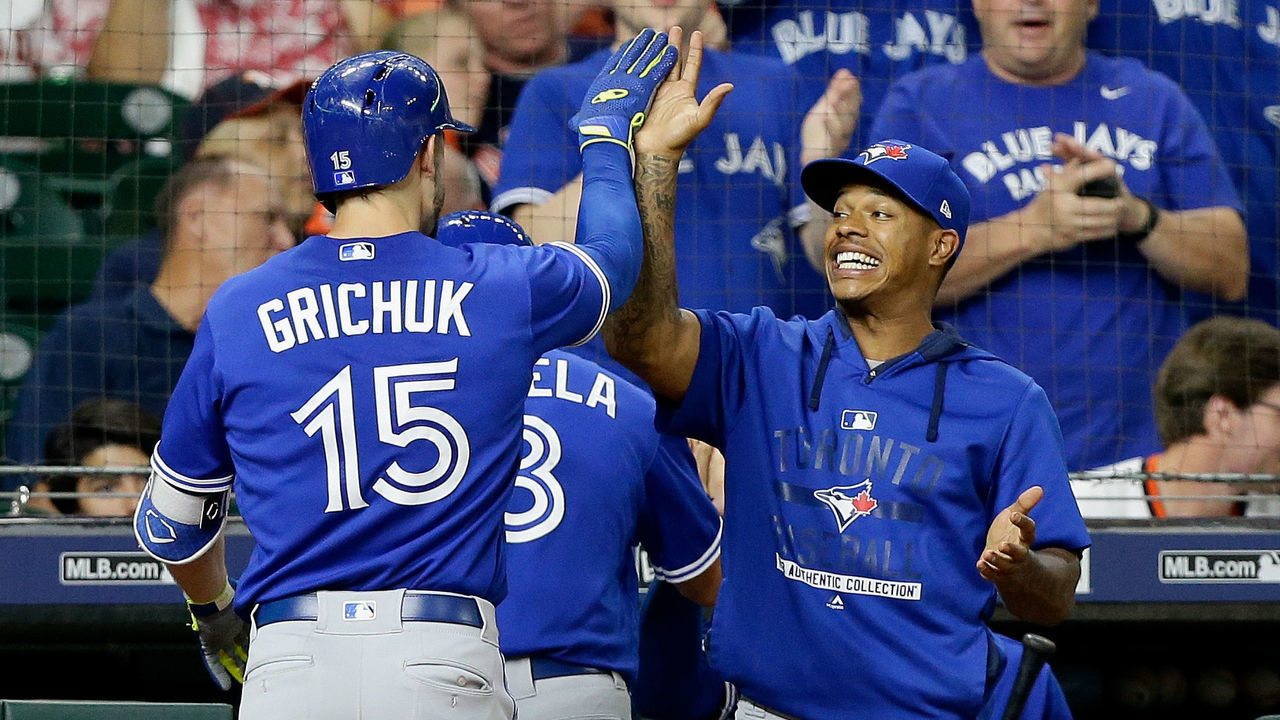 HOUSTON, TX - JUNE 25: Randal Grichuk #15 of the Toronto Blue Jays receives a high five from Marcus Stroman #6 after hitting a two-run home run against the Houston Astros in the eighth inning at Minute Maid Park on June 25, 2018 in Houston, Texas.