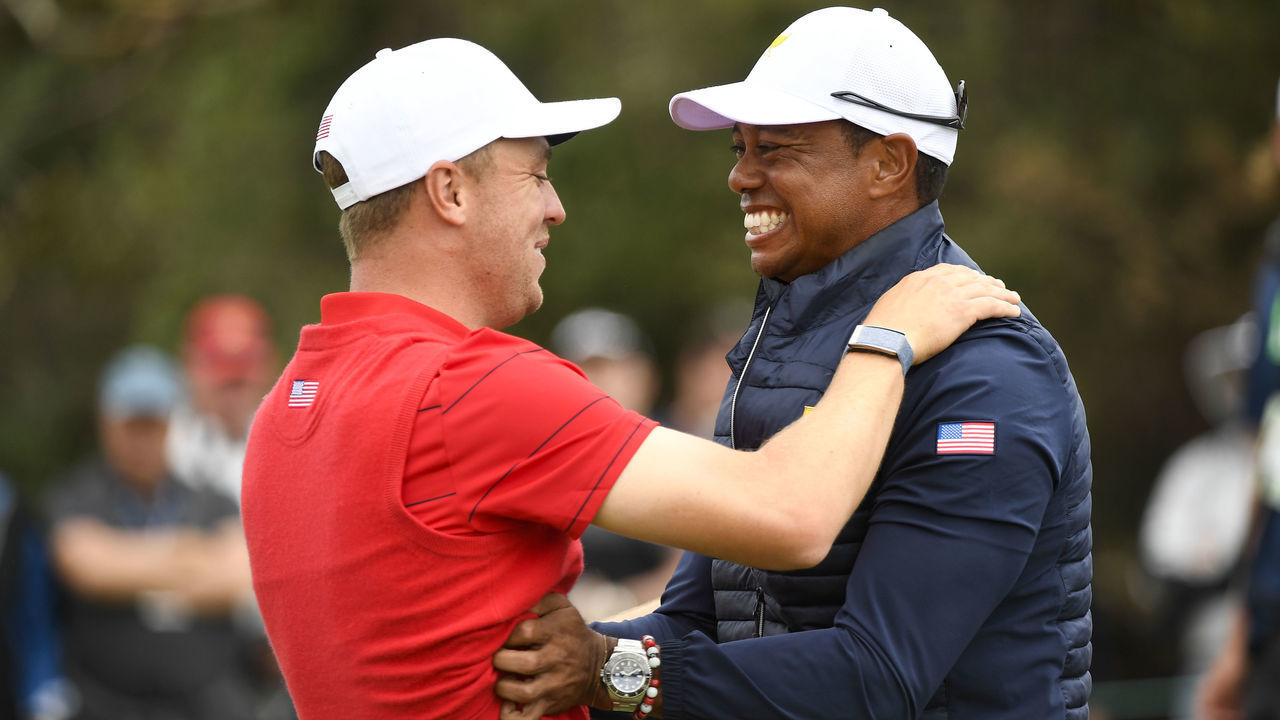 VICTORIA , AUSTRALIA - DECEMBER 15: U.S. Teams Justin Thomas and U.S. Team Captain Tiger Woods celebrate winning the Presidents Cup during the final round singles matches at the Presidents Cup at The Royal Melbourne Golf Club on December 15, 2019, in Victoria , Australia.