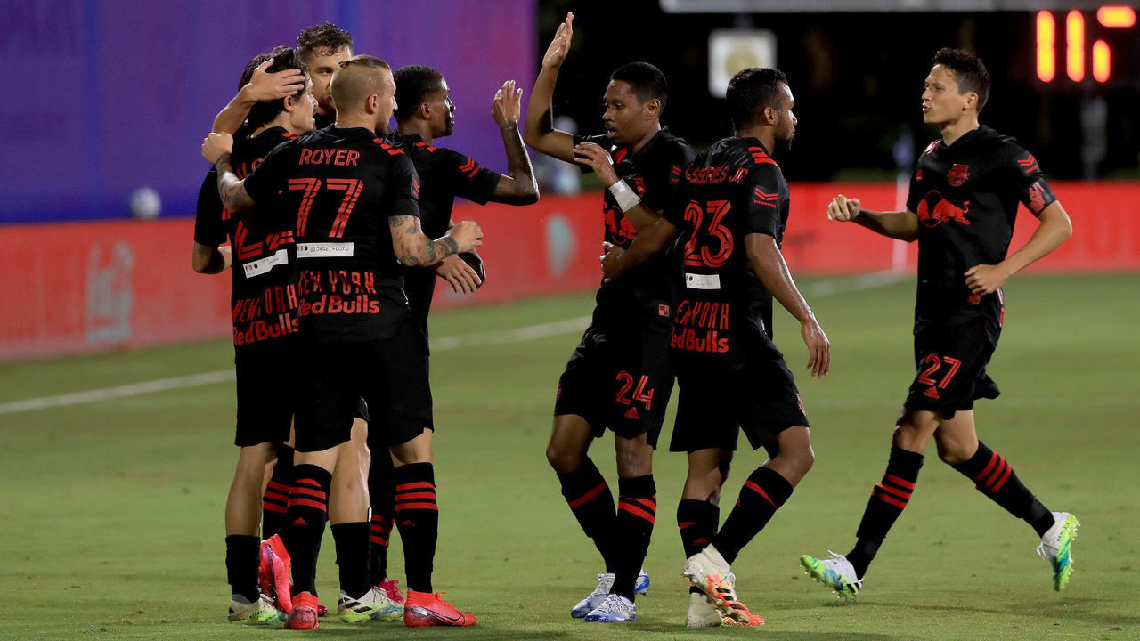 REUNION, FLORIDA - JULY 11: Florian Valot #22 of New York Red Bulls celebrates with his teammates after scoring a goal in the fourth minute against Brad Guzan #1 of Atlanta United during a match in the MLS Is Back Tournament at ESPN Wide World of Sports Complex on July 11, 2020 in Reunion, Florida.