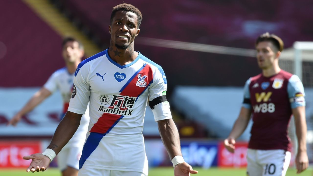 Crystal Palace's Ivorian striker Wilfried Zaha reacts during the English Premier League football match between Aston Villa and Crystal Palace at Villa Park in Birmingham, central England on July 12, 2020.