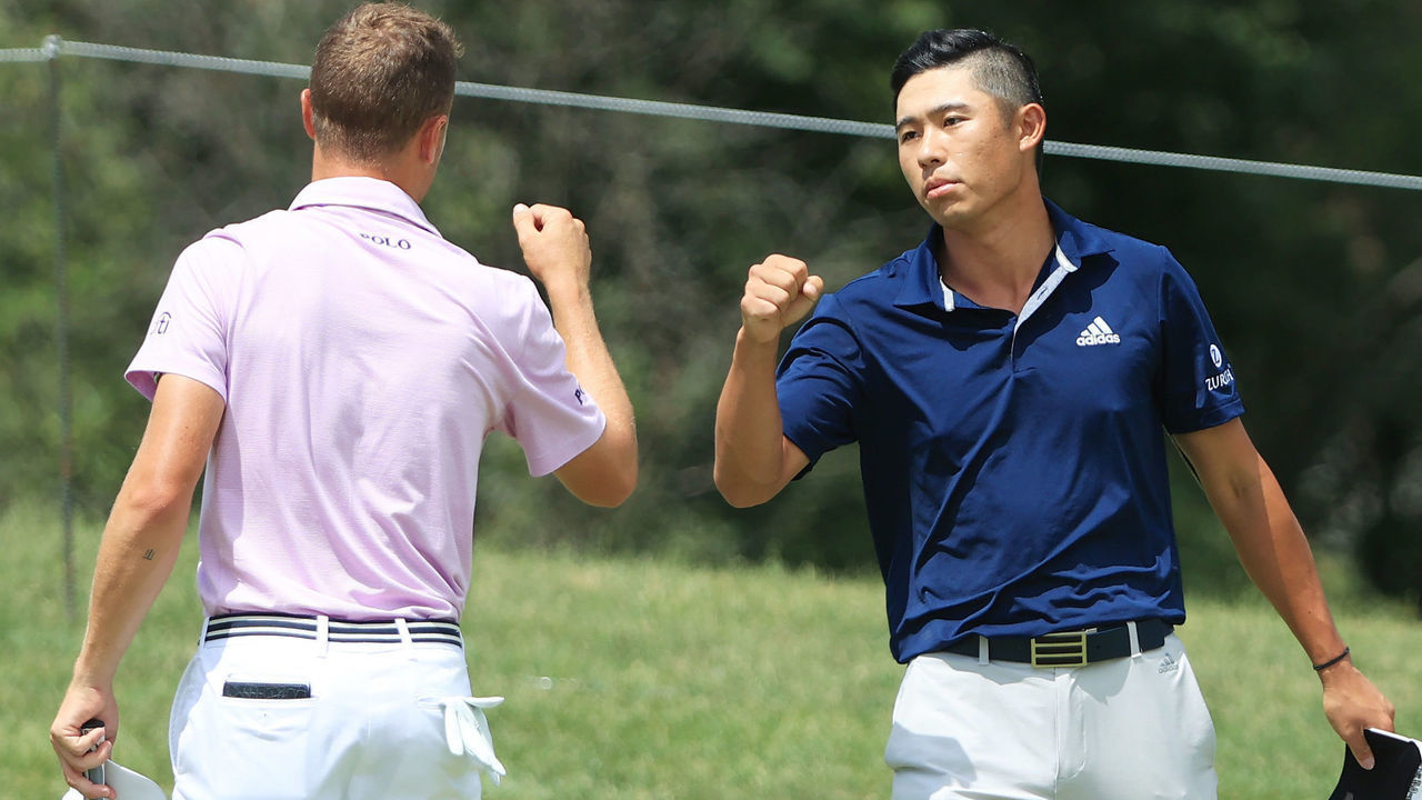 DUBLIN, OHIO - JULY 12: Collin Morikawa of the United States is congratulated by Justin Thomas of the United States after Morikawa defeated Thomas on the tenth green in the third playoff hole during the final round of the Workday Charity Open on July 12, 2020 at Muirfield Village Golf Club in Dublin, Ohio.