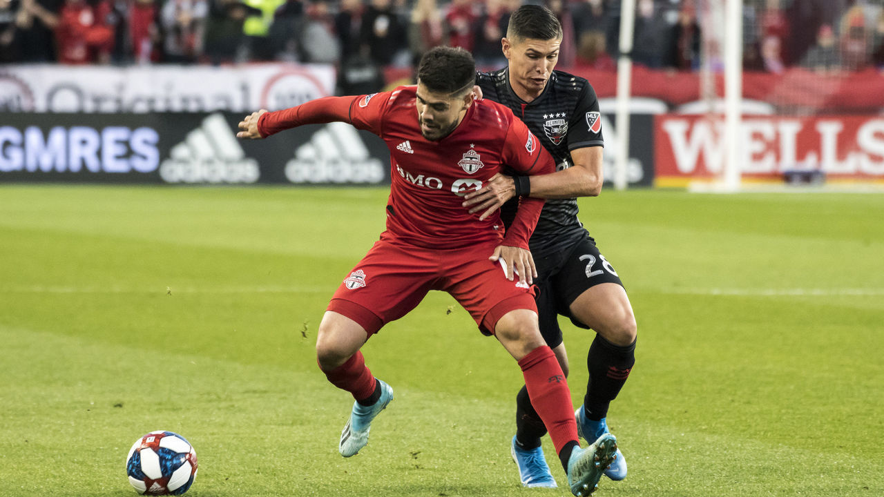 TORONTO, CANADA - 2019/10/19: Alejandro Pozuelo (10) and Joseph Mora (28) are seen in action during the MLS game between Toronto FC and DC United at the Bmo field in Toronto. (Final score; Toronto fc 5:1 Dc United).
