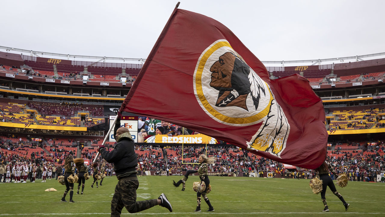 LANDOVER, MD - NOVEMBER 17: A general view of a Washington Redskins flag and cheerleaders during the second half of the game between the Washington Redskins and the New York Jets at FedExField on November 17, 2019 in Landover, Maryland.