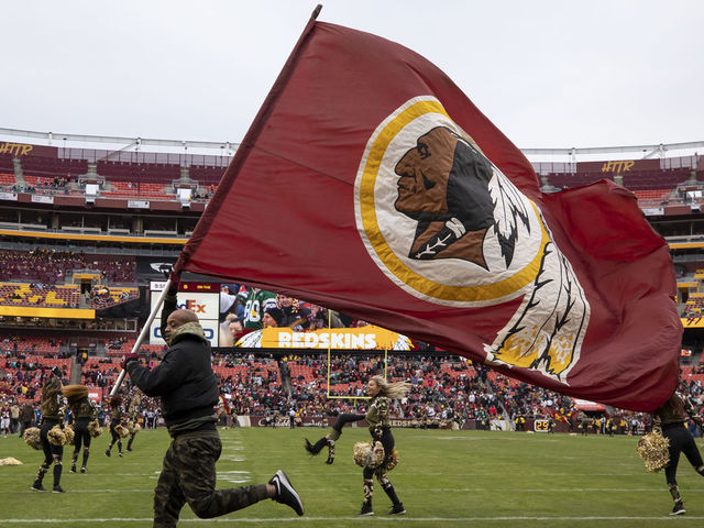 LANDOVER, MD - NOVEMBER 17: A general view of a Washington Redskins flag and cheerleaders during the second half of the game between the Washington Redskins and the New York Jets at FedExField on November 17, 2019 in Landover, Maryland.
