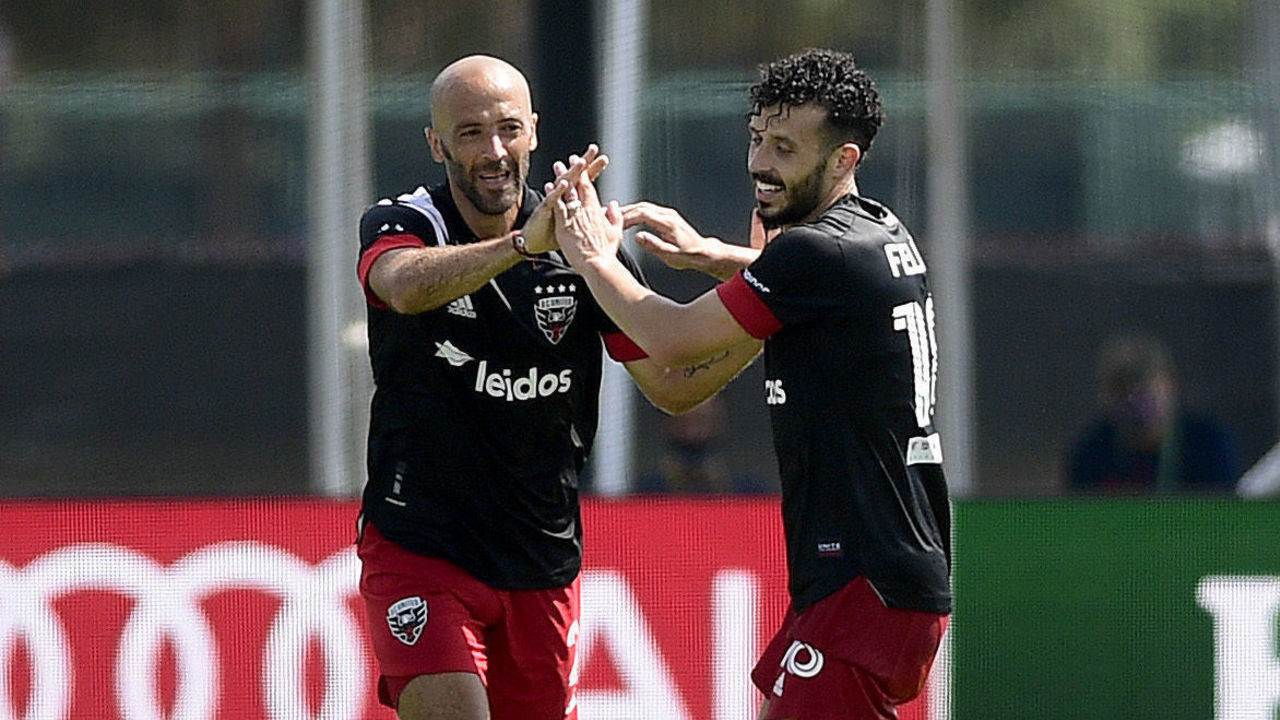 REUNION, FLORIDA - JULY 13: Federico Higuaín #2 and Edison Flores #10 of D.C. United celebrate Higuáin's goal in the second half during a match against Toronto FC in the MLS Is Back Tournament at ESPN Wide World of Sports Complex on July 13, 2020 in Reunion, Florida. The final score was 2-2.