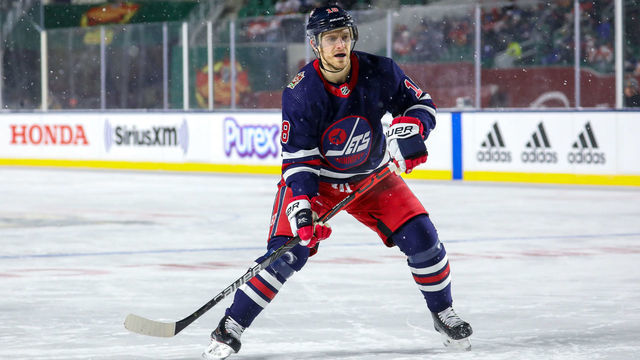 REGINA, SK - OCTOBER 26: Bryan Little #18 of the Winnipeg Jets keeps an eye on the play during third period action against the Calgary Flames during the 2019 Tim Hortons NHL Heritage Classic at Mosaic Stadium on October 26, 2019 in Regina, Saskatchewan, Canada. The Jets defeated the Flames 2-1 in overtime.