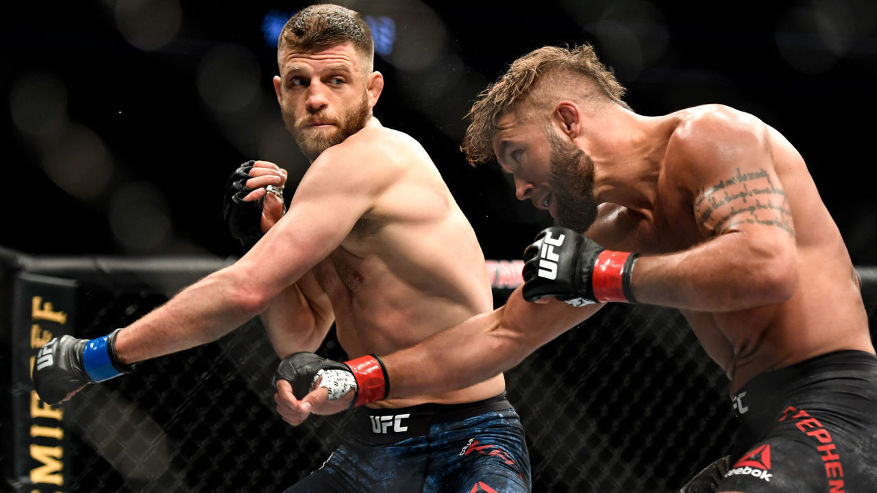 JACKSONVILLE, FL - MAY 09: Calvin Kattar (L) of the United States punches Jeremy Stephens (R) of the United States in their Featherweight fight during UFC 249 at VyStar Veterans Memorial Arena on May 9, 2020 in Jacksonville, Florida.