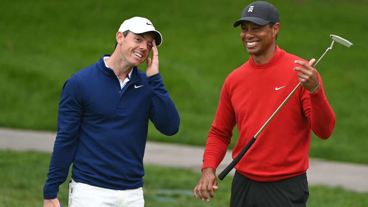 SAN DIEGO, CA - JANUARY 26: Rory McIlroy of Northern Ireland laughs with Tiger Woods on the putting green during the final round of the Farmers Insurance Open at Torrey Pines South on January 26, 2020 in San Diego, California.