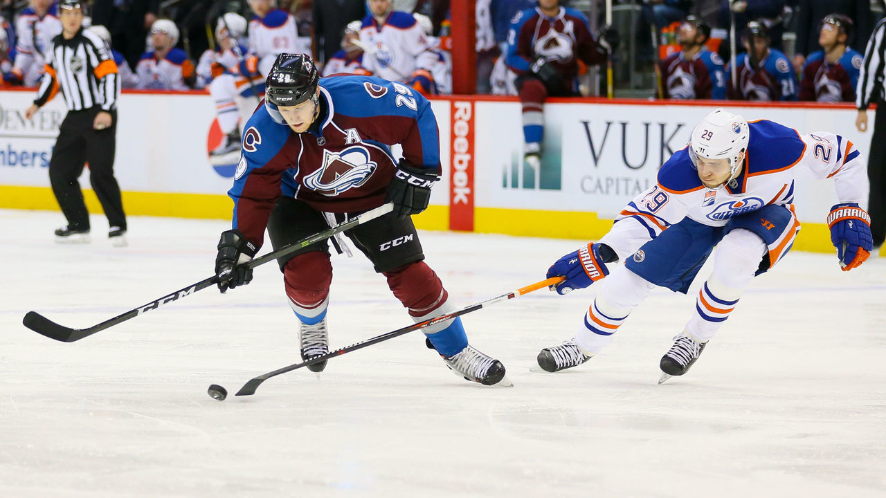 DENVER, CO - NOVEMBER 23: Leon Draisaitl #29 of the Edmonton Oilers pokes the puck away from Nathan MacKinnon #29 of the Colorado Avalanche during a power play in the second period at Pepsi Center on November 23, 2016 in Denver, Colorado.