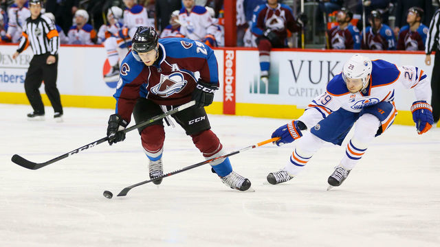 DENVER, CO - NOVEMBER 23: Leon Draisaitl #29 of the Edmonton Oilers pokes the puck away from Nathan MacKinnon #29 of the Colorado Avalanche during a power play in the second period at Pepsi Center on November 23, 2016 in Denver, Colorado.