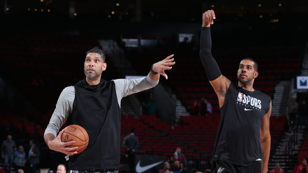 PORTLAND, OR - FEBRUARY 6: Assistant Coach Tim Duncan and LaMarcus Aldridge #12 of the San Antonio Spurs warm up prior to a game against the Portland Trail Blazers on February 6, 2020 at the Moda Center Arena in Portland, Oregon. Mandatory Copyright Notice: Copyright 2020 NBAE