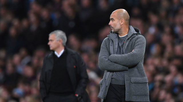 MANCHESTER, ENGLAND - NOVEMBER 11: Josep Guardiola of Manchester City looks on in front of Jose Mourinho fo Manchester United during the Premier League match between Manchester City and Manchester United at Etihad Stadium on November 11, 2018 in Manchester, United Kingdom.