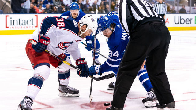 TORONTO, ON - OCTOBER 21: Columbus Blue Jackets center Boone Jenner #38 takes a face off against Toronto Maple Leafs center Auston Matthews #34 during the second period at the Scotiabank Arena on October 21, 2019 in Toronto, Ontario, Canada.