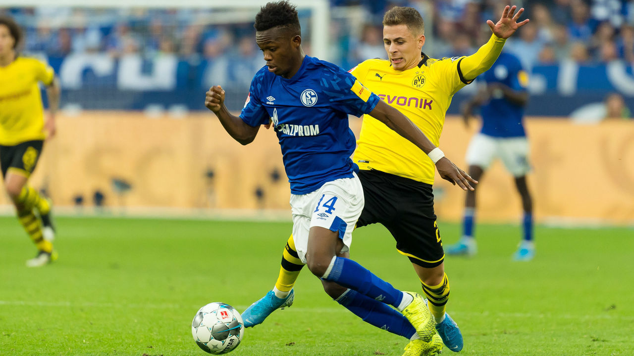GELSENKIRCHEN, GERMANY - OCTOBER 26: Rabbi Matondo of FC Schalke 04 and Thorgan Hazard of Borussia Dortmund battle for the ball during the Bundesliga match between FC Schalke 04 and Borussia Dortmund at Veltins-Arena on October 26, 2019 in Gelsenkirchen, Germany.