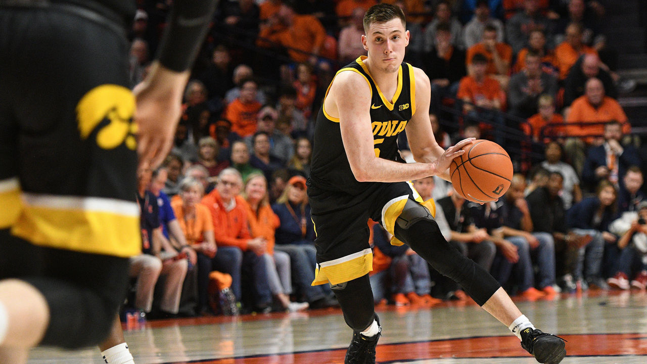 CHAMPAIGN, IL - MARCH 08: Iowa Hawkeyes guard CJ Fredrick (5) passes the ball during the Big Ten Conference college basketball game between the Iowa Hawkeyes and the Illinois Fighting Illini on March 8, 2020, at the State Farm Center in Champaign, Illinois.