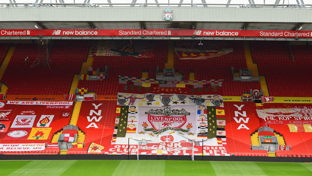 LIVERPOOL, ENGLAND - JUNE 24: (THE SUN OUT, THE SUN ON SUNDAY OUT) Liverpool fans dress the Kop stand with flags and banners ahead of the Premier League match between Liverpool and Crystal Palace at Anfield on June 24, 2020 in Liverpool, England.