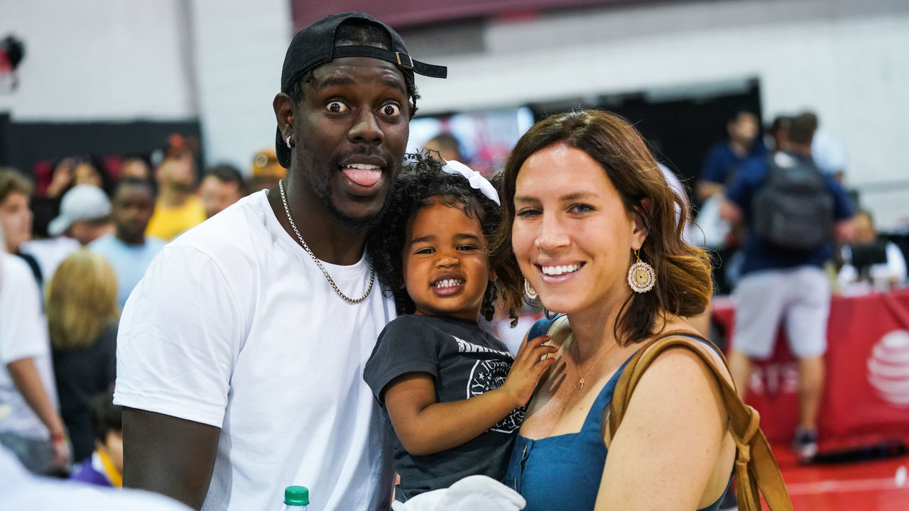 LAS VEGAS, NEVADA - JULY 06: (L-R) Jrue Holiday, daughter J.T. and wife Lauren Holiday smile during the NBA Summer League on July 06, 2019 in Las Vegas, Nevada.