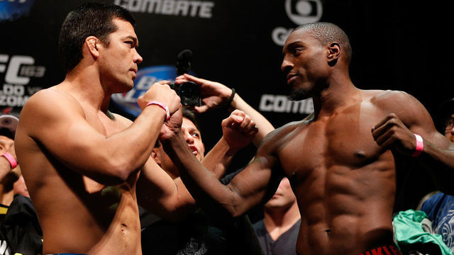 RIO DE JANEIRO, BRAZIL - AUGUST 02: (L-R) Opponents Lyoto Machida and Phil Davis face off during the UFC 163 weigh-in at HSBC Arena on August 2, 2013 in Rio de Janeiro, Brazil.