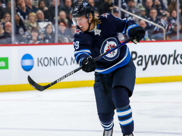 WINNIPEG, MB - MARCH 9: Patrik Laine #29 of the Winnipeg Jets takes a shot on goal during second period action against the Arizona Coyotes at the Bell MTS Place on March 9, 2020 in Winnipeg, Manitoba, Canada. The Jets defeated the Coyotes 4-2.