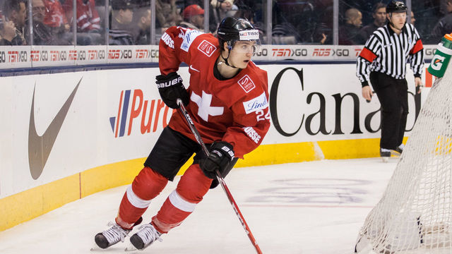 TORONTO, ON - JANUARY 02: Forward Pius Suter #24 of Switzerland moves the puck against Germany during the 2015 IIHF World Junior Championship on January 02, 2015 at the Air Canada Centre in Toronto, Ontario, Canada.