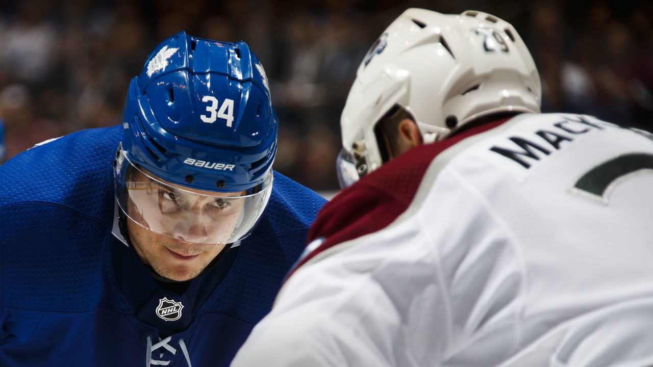 TORONTO, ON - JANUARY 22: Auston Matthews #34 of the Toronto Maple Leafs lines up for a face-off against Nathan MacKinnon #29 of the Colorado Avalanche during the third period at the Air Canada Centre on January 22, 2018 in Toronto, Ontario, Canada.