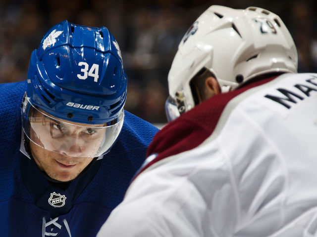 TORONTO, ON - JANUARY 22: Auston Matthews #34 of the Toronto Maple Leafs lines up for a face-off against Nathan MacKinnon #29 of the Colorado Avalanche during the third period at the Air Canada Centre on January 22, 2018 in Toronto, Ontario, Canada.