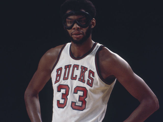UNDATED: Milwaukee Bucks' center Kareem Abdul Jabbar #33 stands on the court wearing procetive goggles.