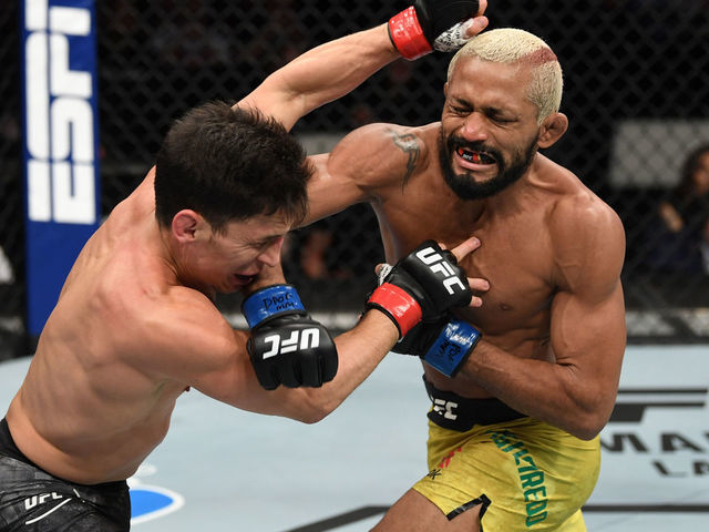 NORFOLK, VA - FEBRUARY 29: (R-L) Deiveson Figueiredo punches Joseph Benavidez in their flyweight championship bout during the UFC Fight Night event at Chartway Arena on February 29, 2020 in Norfolk, Virginia.