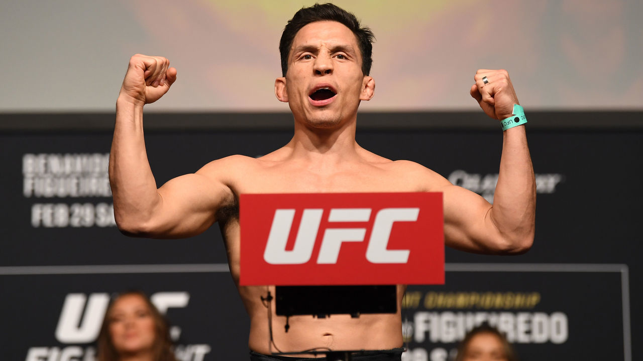 NORFOLK, VA - FEBRUARY 28: Joseph Benavidez poses on the scale during the UFC Fight Night ceremonial weigh-in at Chartway Arena on February 28, 2020 in Norfolk, Virginia.