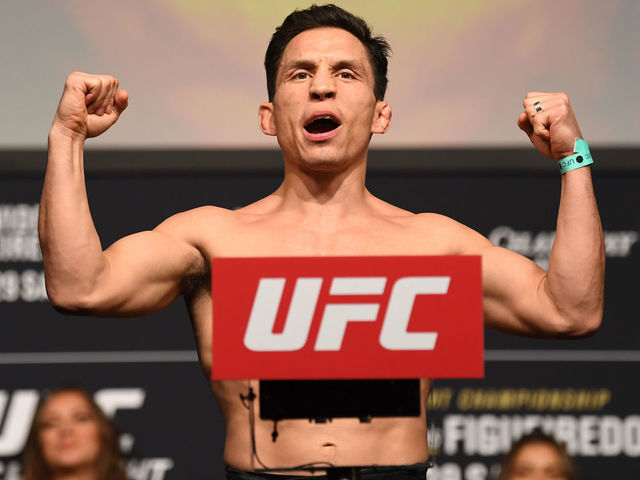 NORFOLK, VA - FEBRUARY 28: Joseph Benavidez poses on the scale during the UFC Fight Night ceremonial weigh-in at Chartway Arena on February 28, 2020 in Norfolk, Virginia.